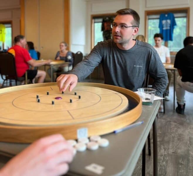 Josh Carrafiello at a Crokinole Board